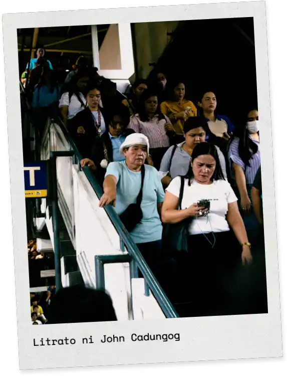 Commuters descending a crowded urban stairway